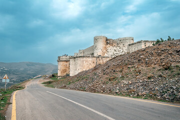 Krak des Chevaliers or Crac des Chevaliers crusader castle, Syria - obrazy, fototapety, plakaty