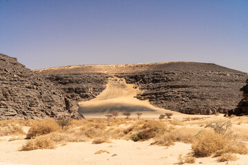 view in the Sahara desert of Tadrart rouge tassili najer in Djanet City  ,Algeria.colorful orange sand, rocky mountains