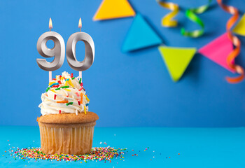Birthday cake with candle number 90 - Blue background