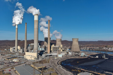 Power Plant with Blue Sky and Pile of Black Coal