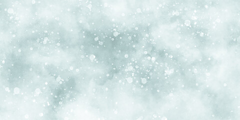 Abstract winter morning shiny white snow is falling randomly with various bokeh particles, beautiful blue watercolor background with glitter particles for wallpaper and design and decoration.