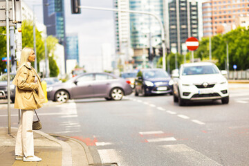 Portrait of young woman on the street in the city