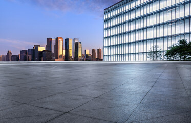 Empty city square and skyline with modern buildings background