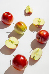 Creative layout made of apple fruits on white background with shadow. Healthy food and vitamin concept. Minimal style.