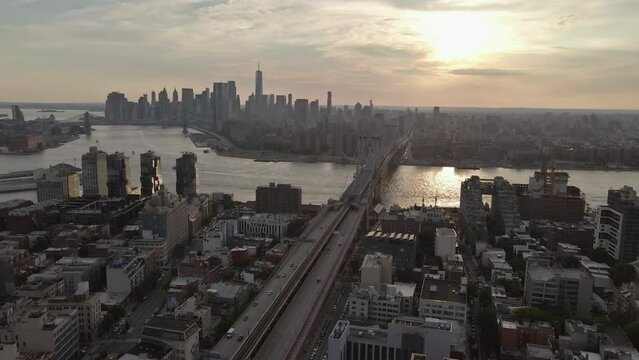 Sunset enhances beauty of Williamsburg Bridge offering an enchanting panoramic view from across East River in Brooklyn