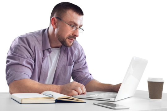 Happy cheerful businessman working on a laptop in office.
