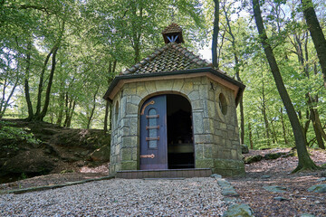 exterior of a little stone chapel along the hiking trail Teutoschleifen around Tecklenburg in Germany.