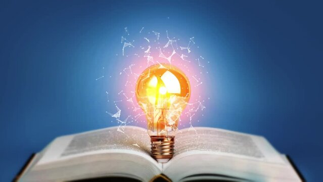 Idea bulb light on open book. Education, study, knowledge concept.