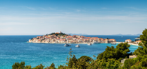 Fototapeta na wymiar Aerial panoramic view with scenic town of Primosten in Croatia, famous and picturesque tourist resort at Adriatic sea coast.