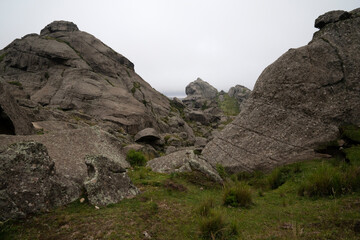 View rocky mountains with fog in an early morning.