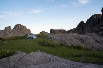 Camping in the top of the rock massif Los Gigantes in Cordoba, Argentina. View of a young woman in...