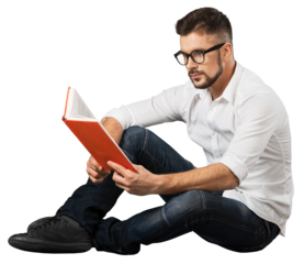 The handsome guy sitting on a floor and reading a book