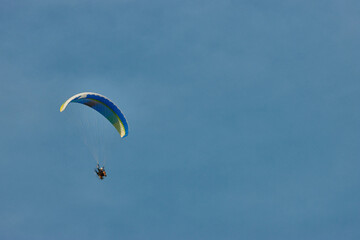 Paraglider flying next to the moon