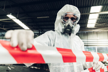 Scientist wear Chemical protection suit check danger chemical, working at dangerous zone in Red and...