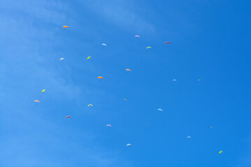 group of paratroopers in the blue sky