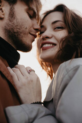 blurred soft focus portrait of beautiful couple in love closeup. Intimate relationship, kiss