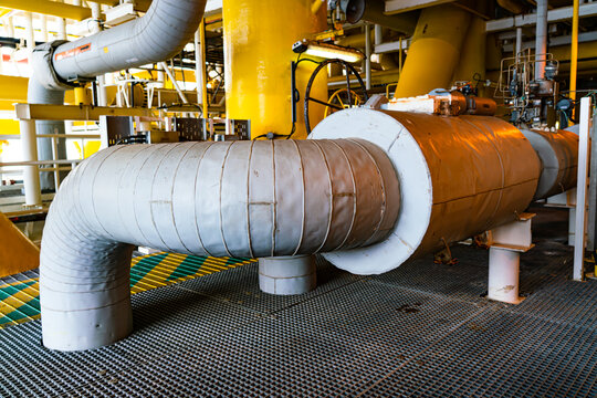 Insulation foam covered with a good waterproof rubber sheet on pipes in offshore oil and gas processing.