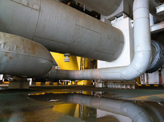 Insulation foam covered with a good waterproof rubber sheet on pipes in offshore oil and gas processing.