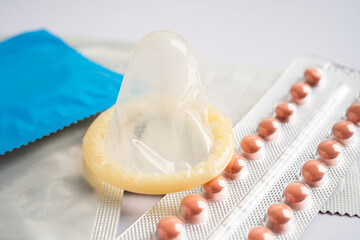 Birth control pills and condom, contraception health and medicine.
