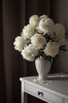 Still-life. Photo of a bouquet of white peonies on the table.