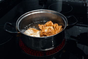 Deliciously Flaky: Step-by-Step Journey of Making Fried Flaky Pastries with Sweet Potato Filling, Fried in Lard, and Glazed with Syrup