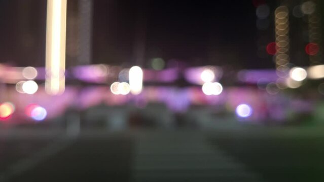 Abstract blurred bokeh city lights with cars passing by