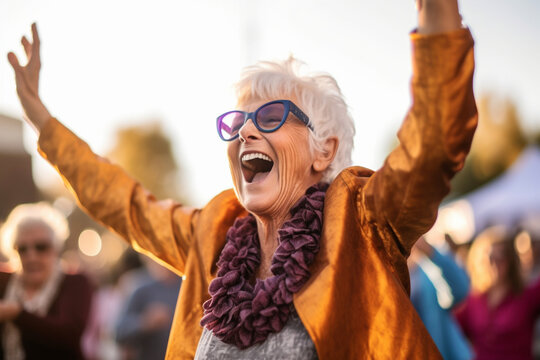 A Joyful Senior Woman Dancing With Her Arms In The Air During A Lively Outdoor Concert, Elderly Happy People, Old Age, Bokeh Generative AI