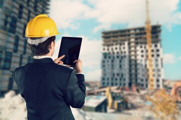 Portrait of proud construction worker managing logistics