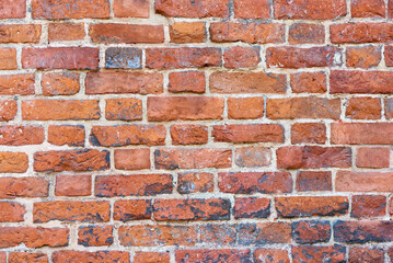 Old brick wall background, brick wall texture, structure. old broken brick, cement joints, close-up. crumbling from old age.