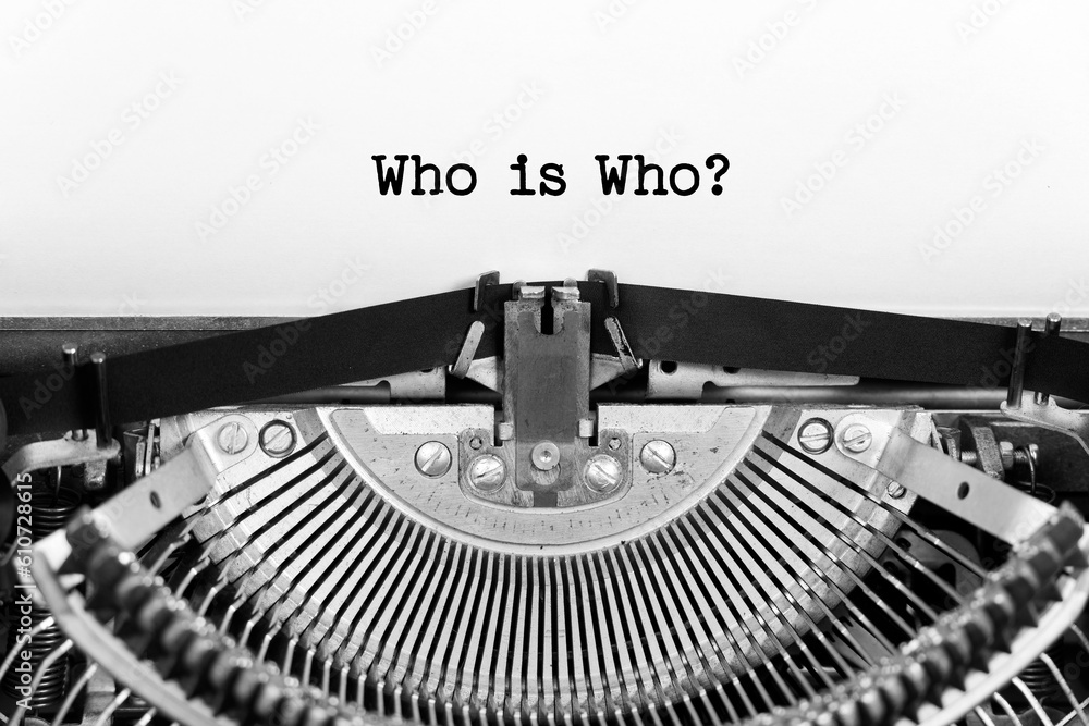 Fototapete Who Is Who phrase close up being typing and centered on a sheet of paper on old vintage typewriter mechanical