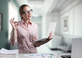 Smiling young business woman manager at work