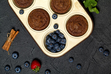 Freshly baked muffins with fresh berries