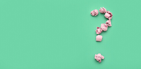 Question mark made of crumpled paper on green background with space for text