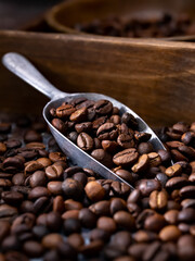Roasted coffee beans in a metal cup