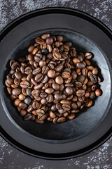 Coffee beans roasted in ceramic bowl