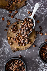 Roasted coffee beans with metal handle and ceramic bowl
