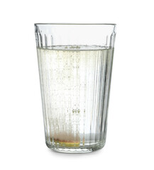 Glass of water with soluble tablet isolated on white background