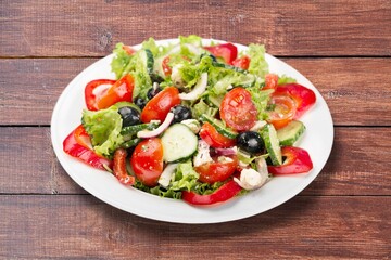 plate of fresh tasty salad with cheese