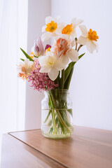 Tulips and daffodils in a jar