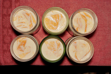 Top view image of dishes with homemade fermented baked milk.