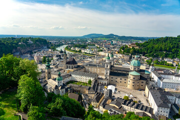 Fototapeta na wymiar view from Hochensalzburg castle with a beautiful view of Salzburg Austria with many churches and towers