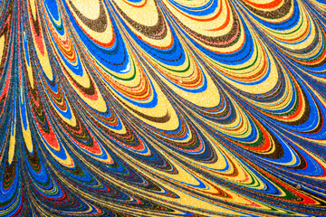 Ebru art. Traditional Turkish Ebru technique. Painting on water, followed by paper prints. Color paint ebru with waves and tile pattern.