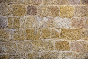 Sun drenched stone wall background