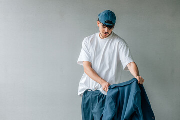 portrait of young urban male fighting with the jacket