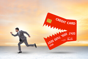 Businessman in credit card debt concept