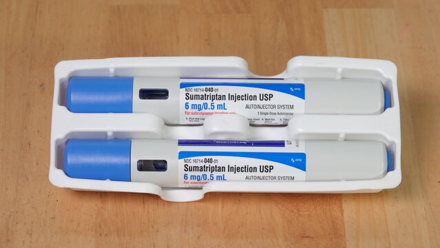 Closeup of two Sumatriptan Autoinjectors on a table. Illustrative Editorial taken in Vista, CA USA on June 7, 2023.