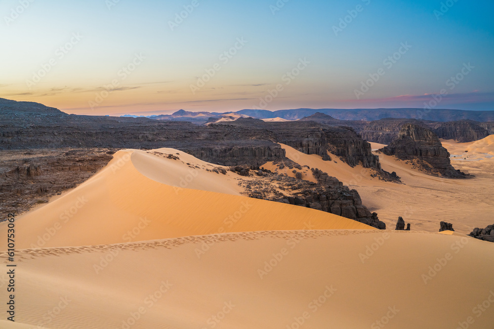 Wall mural view in the Sahara desert of Tadrart rouge tassili najer in Djanet City  ,Algeria.colorful orange sand, rocky mountains