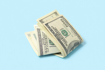 One hundred dollar banknotes on blue background