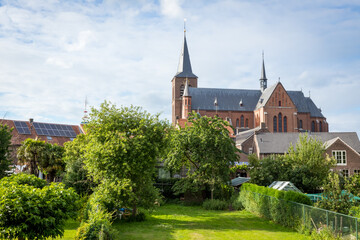 Neer, Limburg, The Netherlands -  The Sint-Martinus church is an oriented three-aisled brick cross basilica.