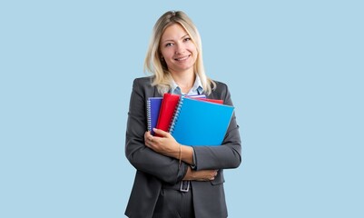 Portrait of a young happy smart woman with books